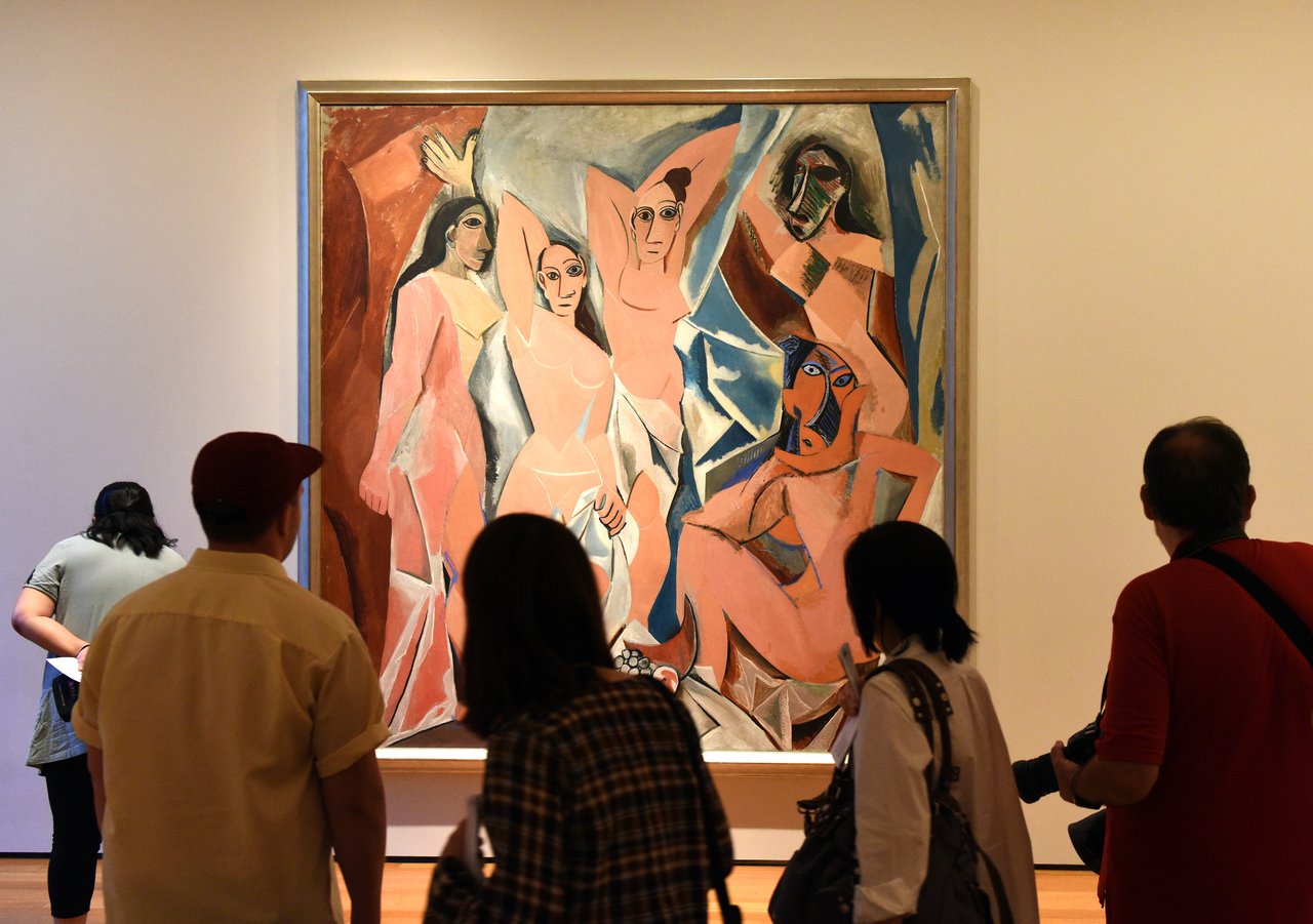 <p>Pablo Picasso painting Les Demoiselles D'Avignon</p>